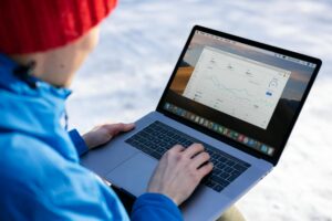 Close-up of laptop screen displaying analytics dashboard with trend data and search metrics