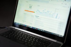 Computer screen displaying colorful analytics dashboard with charts and graphs for social media metrics