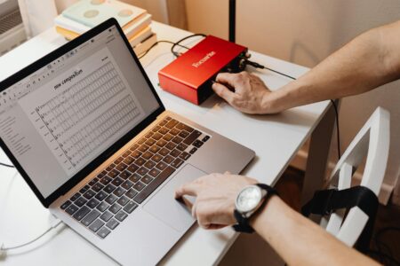 Person recording computer screen for video content creation
