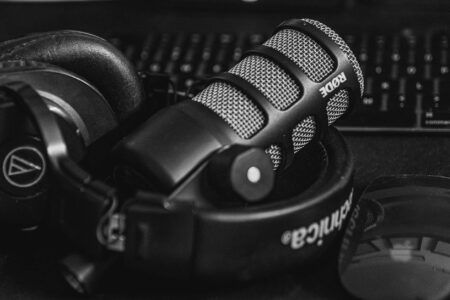 Professional headphones and microphone setup for audio recording and content creation