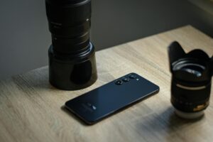 Person holding smartphone taking casual photo, representing authentic social media content creation
