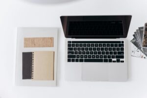 Modern laptop workspace showing e-commerce dashboard and analytics