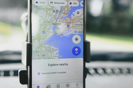 Person using smartphone to view Google Maps location reviews and ratings