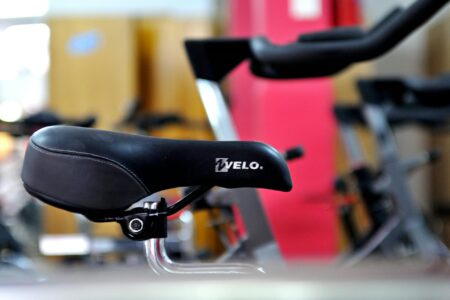 Modern exercise bike in home fitness space with digital display screen