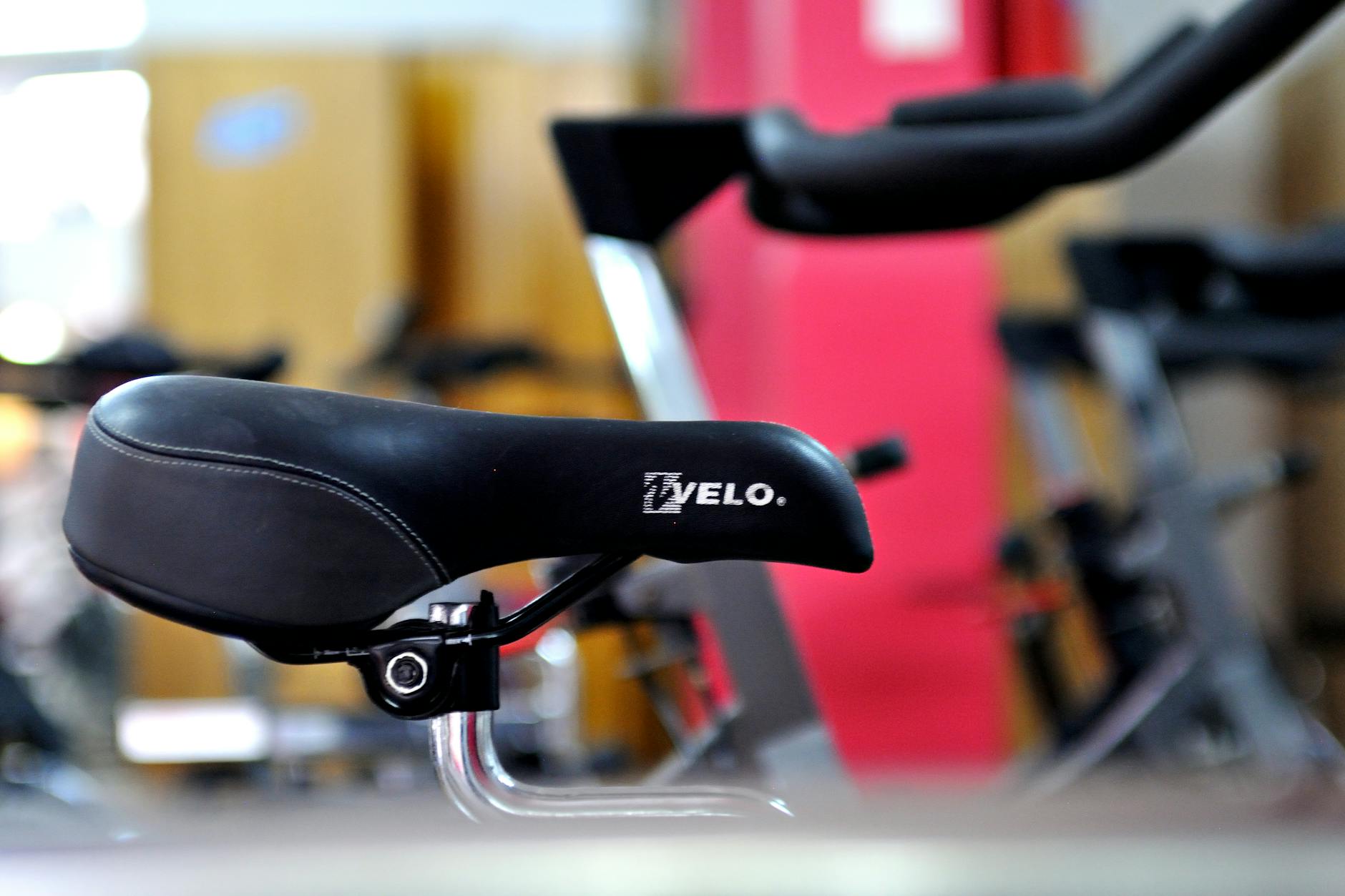 Modern exercise bike in home fitness space with digital display screen