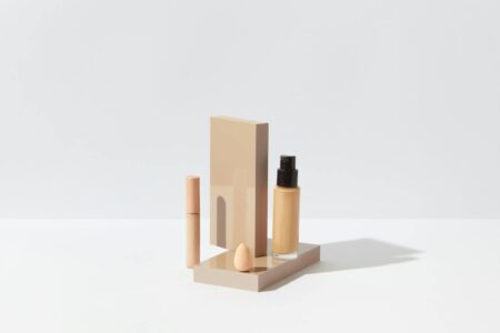 Beauty products arranged on clean white surface showing modern cosmetics packaging