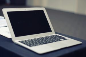 Person reading customer reviews on laptop screen for social media content creation