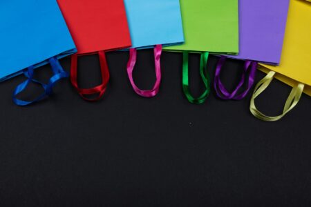 Colorful shopping bags representing retail customer experience and loyalty programs