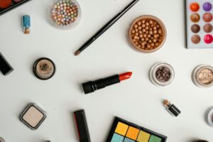 Collection of beauty products arranged on clean surface showing modern cosmetic packaging
