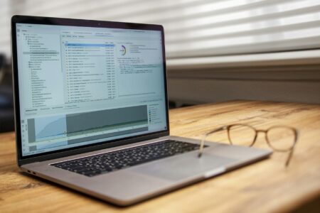 Laptop screen displaying data analytics and social media metrics for content planning