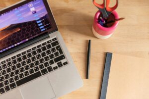 Modern laptop workspace with digital marketing tools and analytics displayed on screen