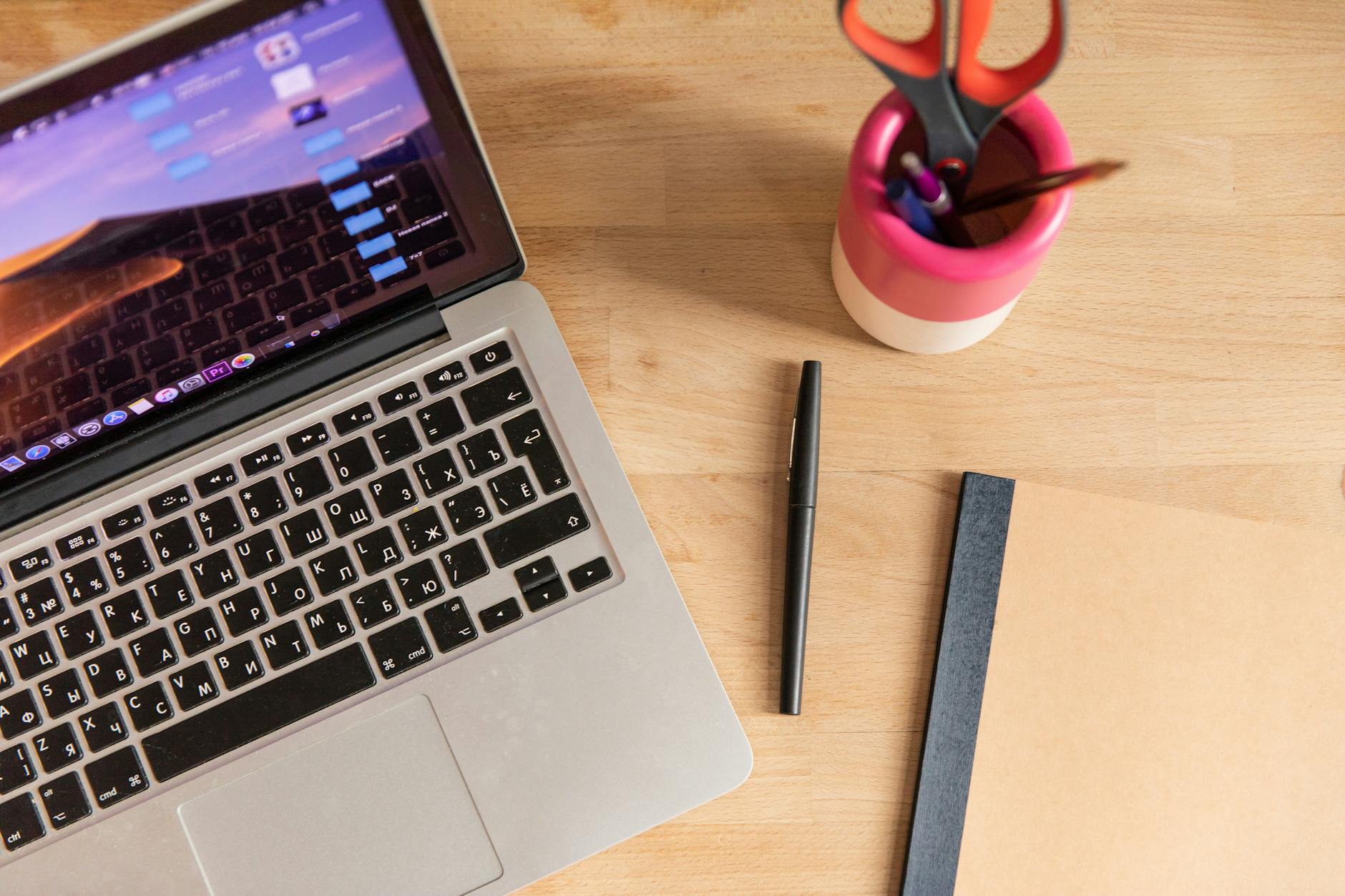 Modern laptop workspace with digital marketing tools and analytics displayed on screen