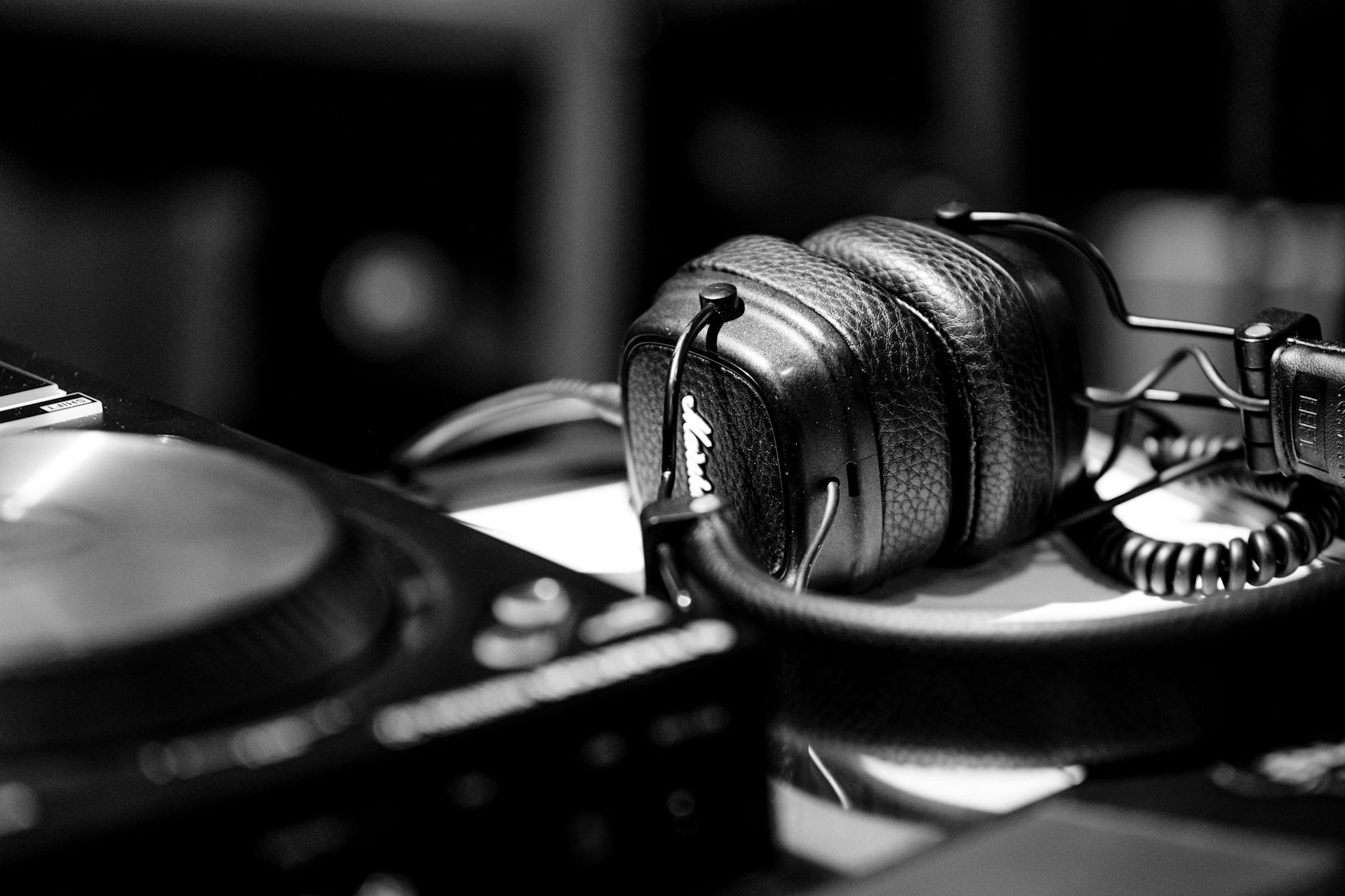 Person wearing headphones while looking at smartphone, representing music streaming data analysis