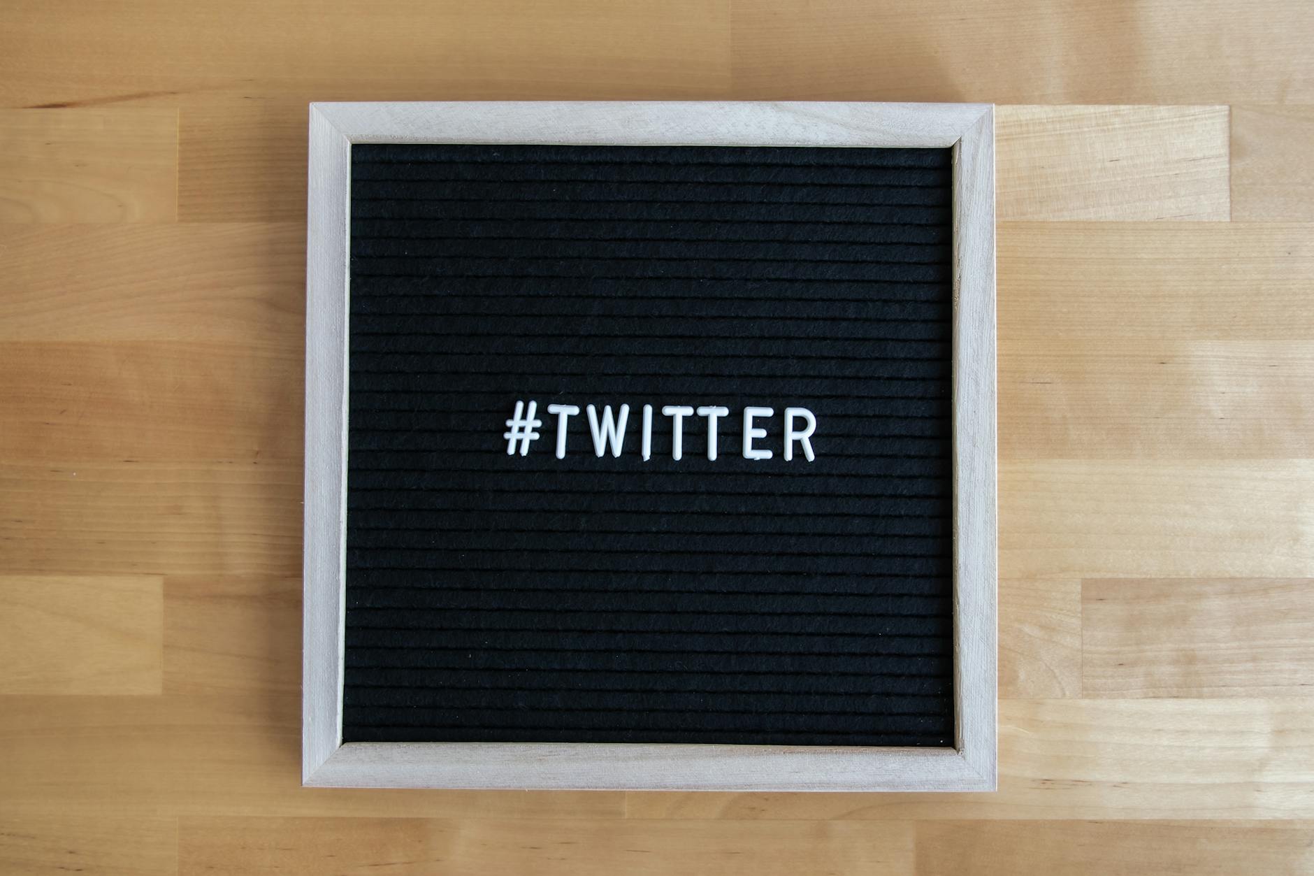 Person using smartphone with social media apps visible on screen