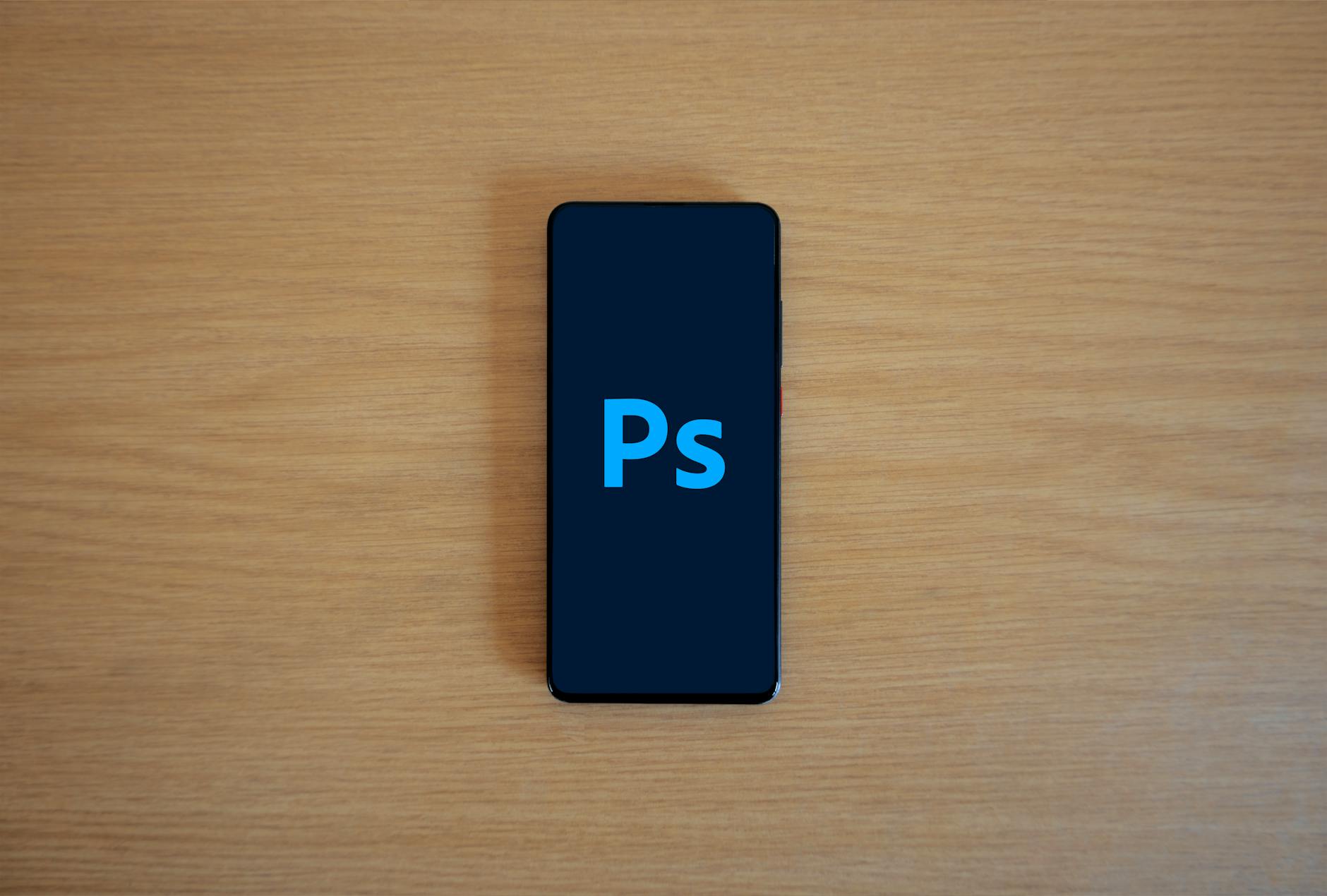 Smartphone displaying colorful social media graphics and design templates on screen