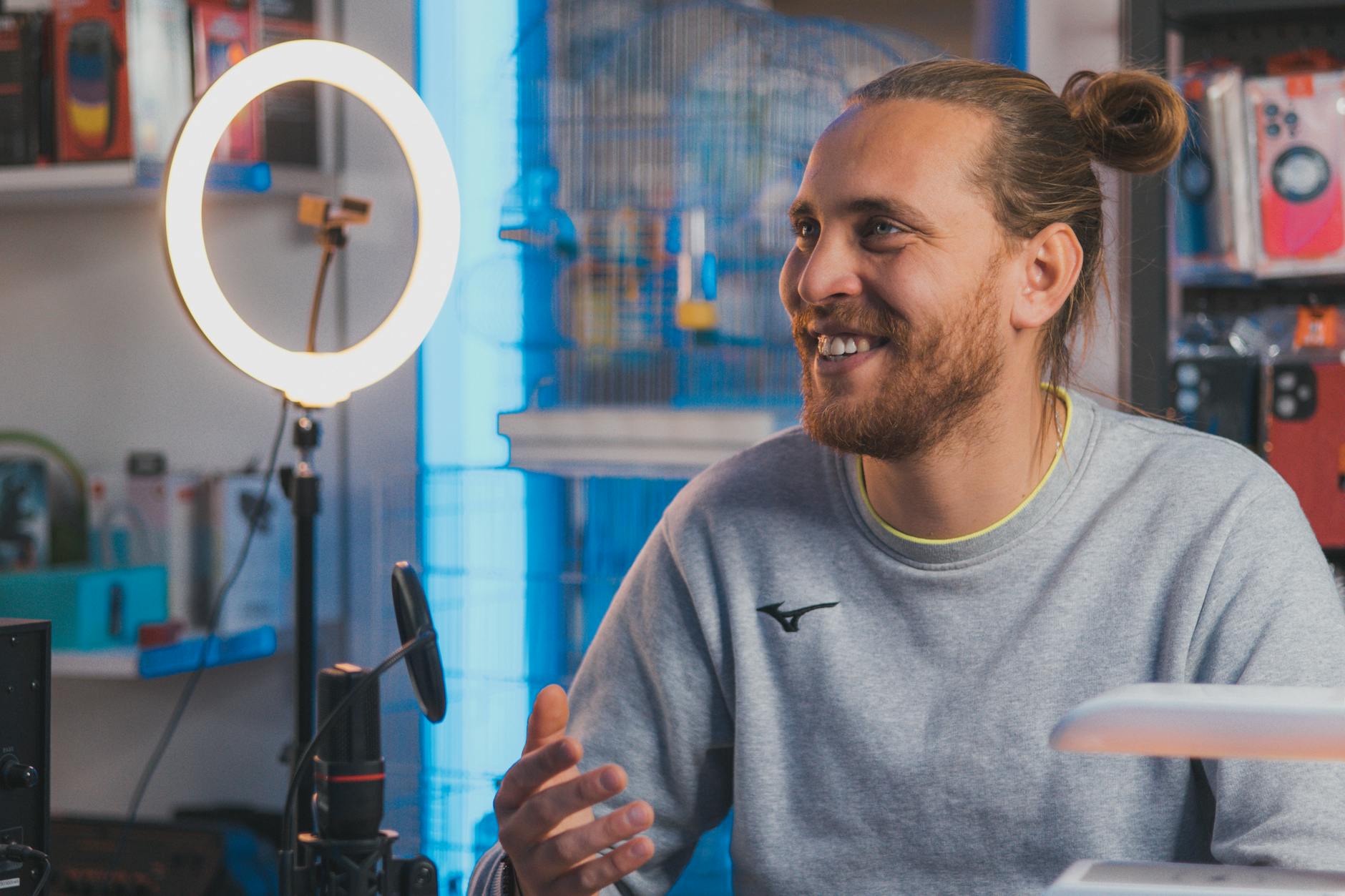 Content creator filming product review video with professional lighting setup