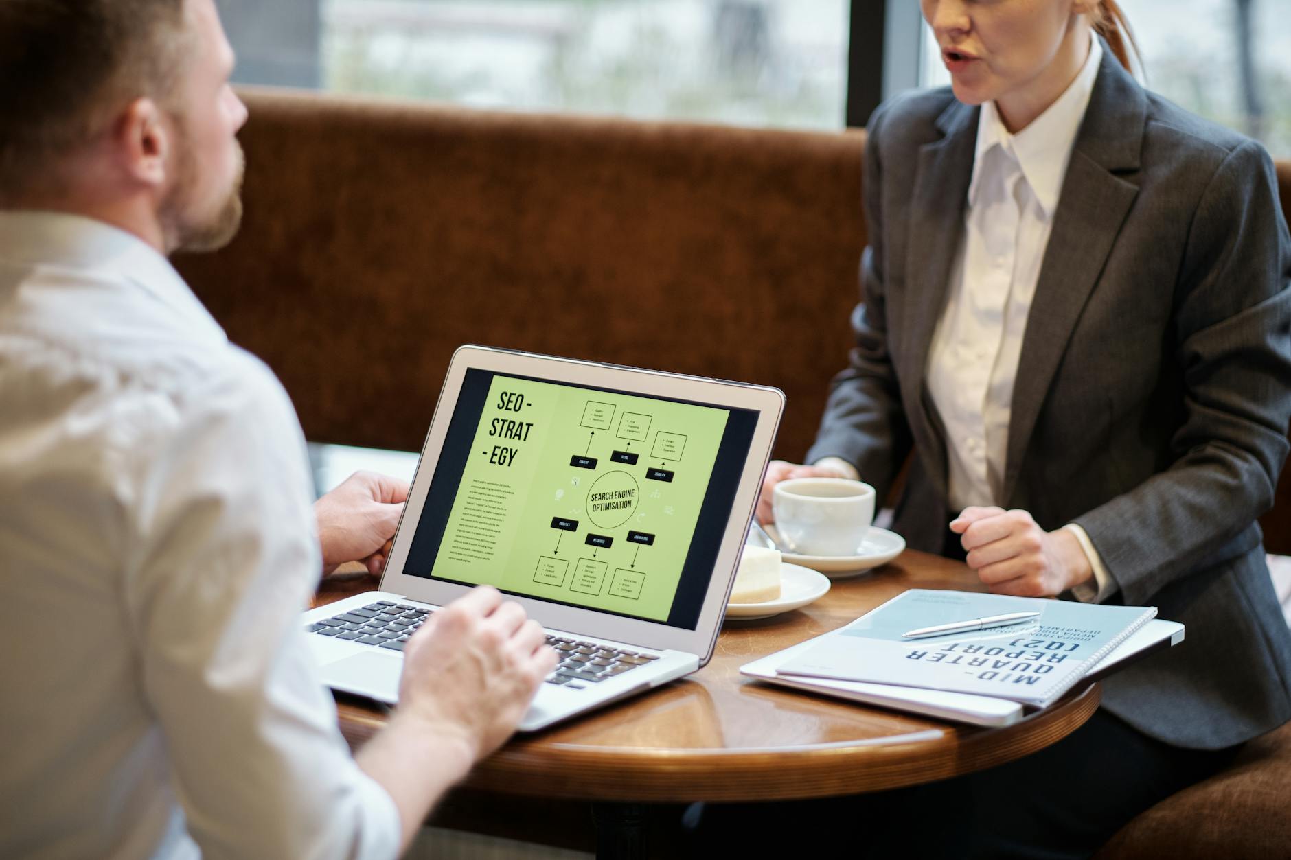 Business team analyzing mobile app strategy and user engagement metrics on digital devices