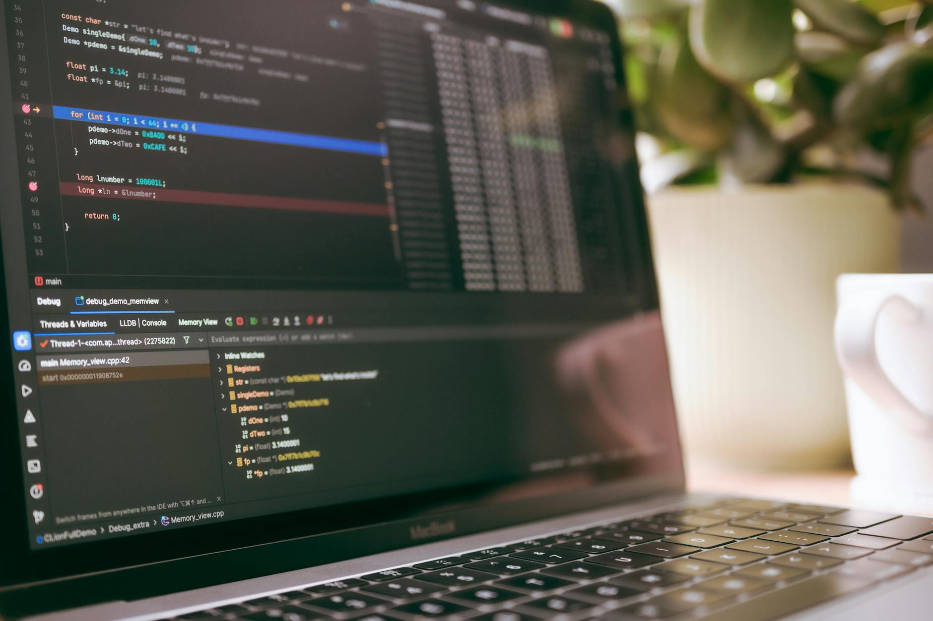 Laptop computer with code editor open showing web development and analytics implementation