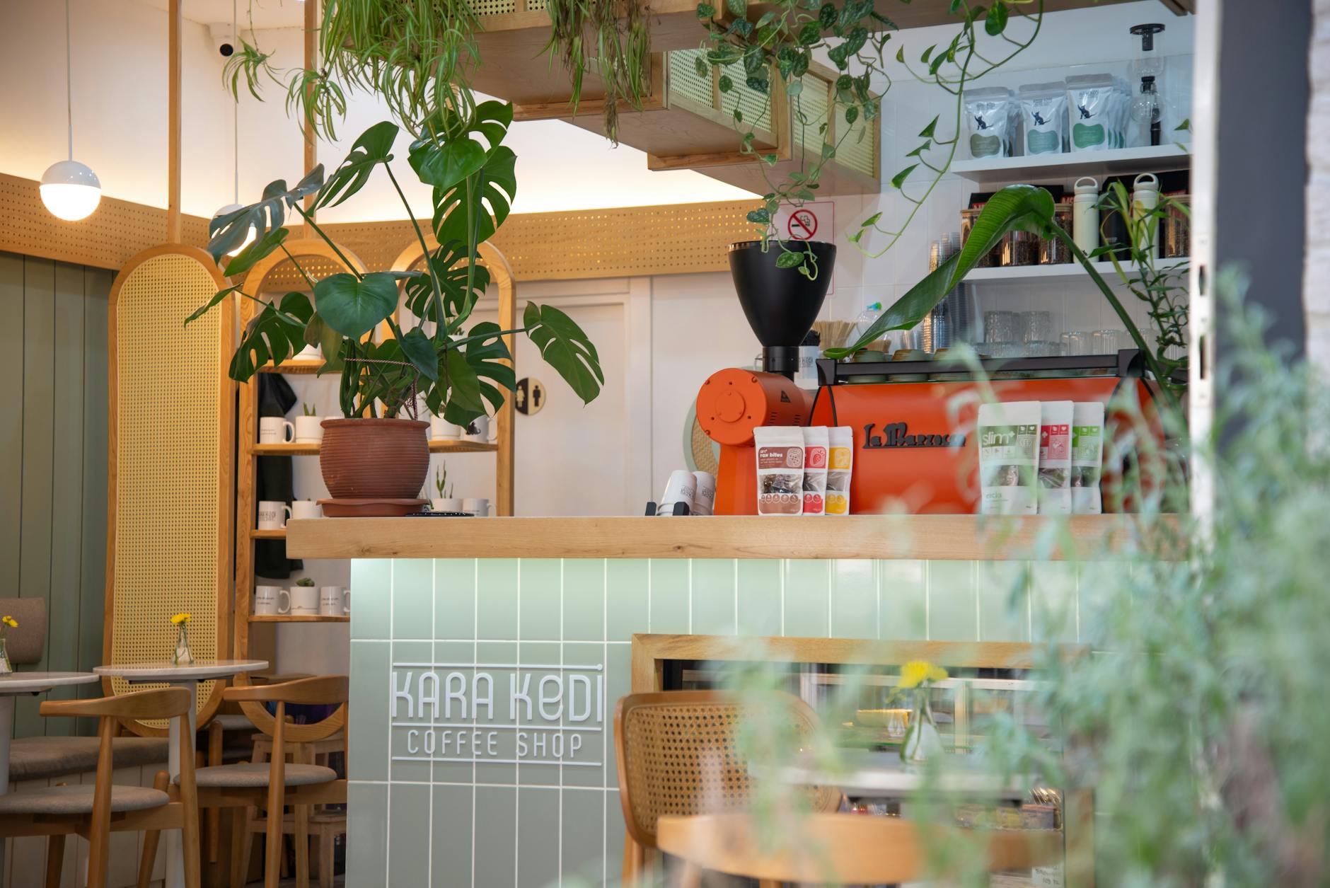 Cozy local coffee shop interior with customers and modern point-of-sale system