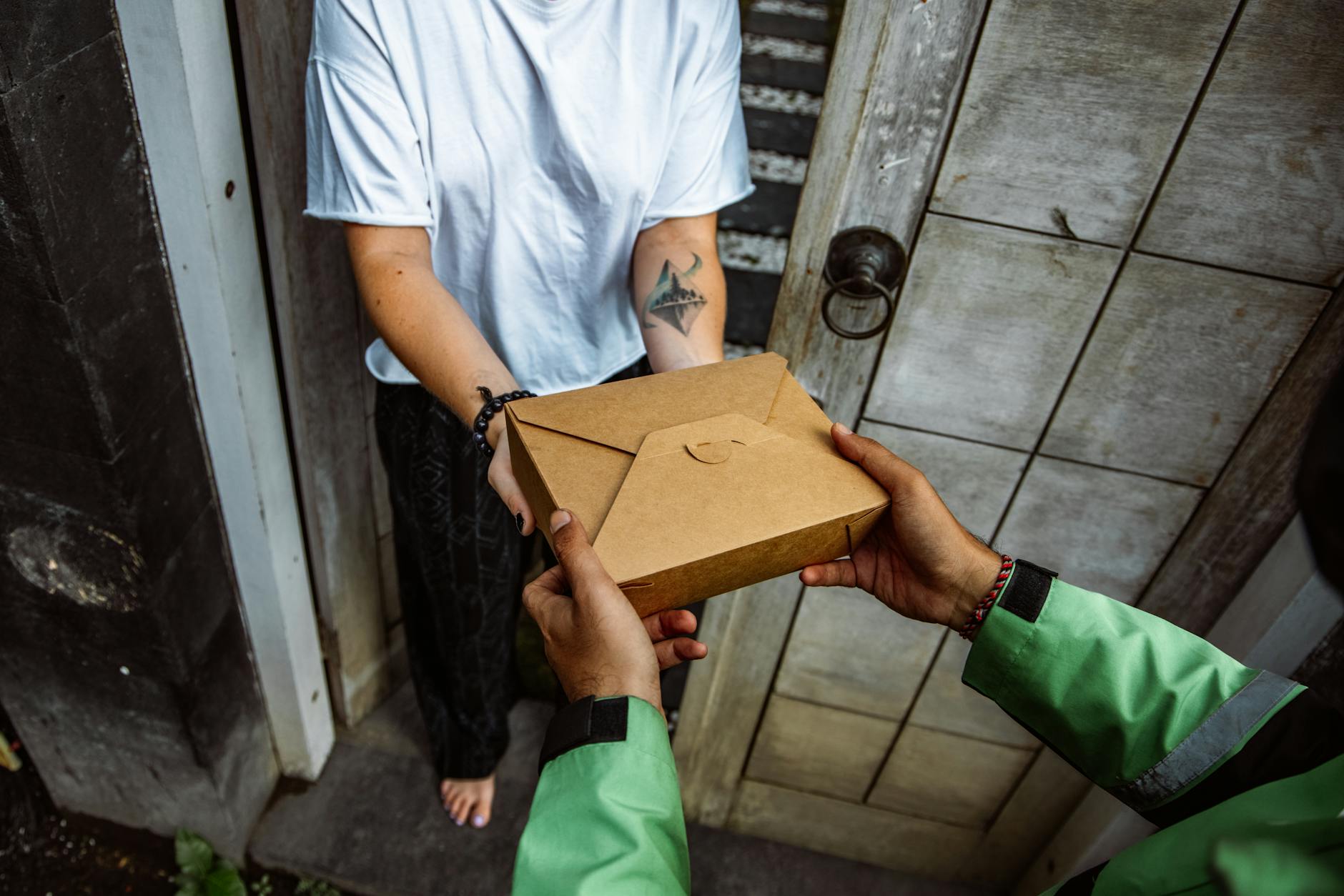 Subscription box package being delivered to customer's doorstep showing the final personalized experience