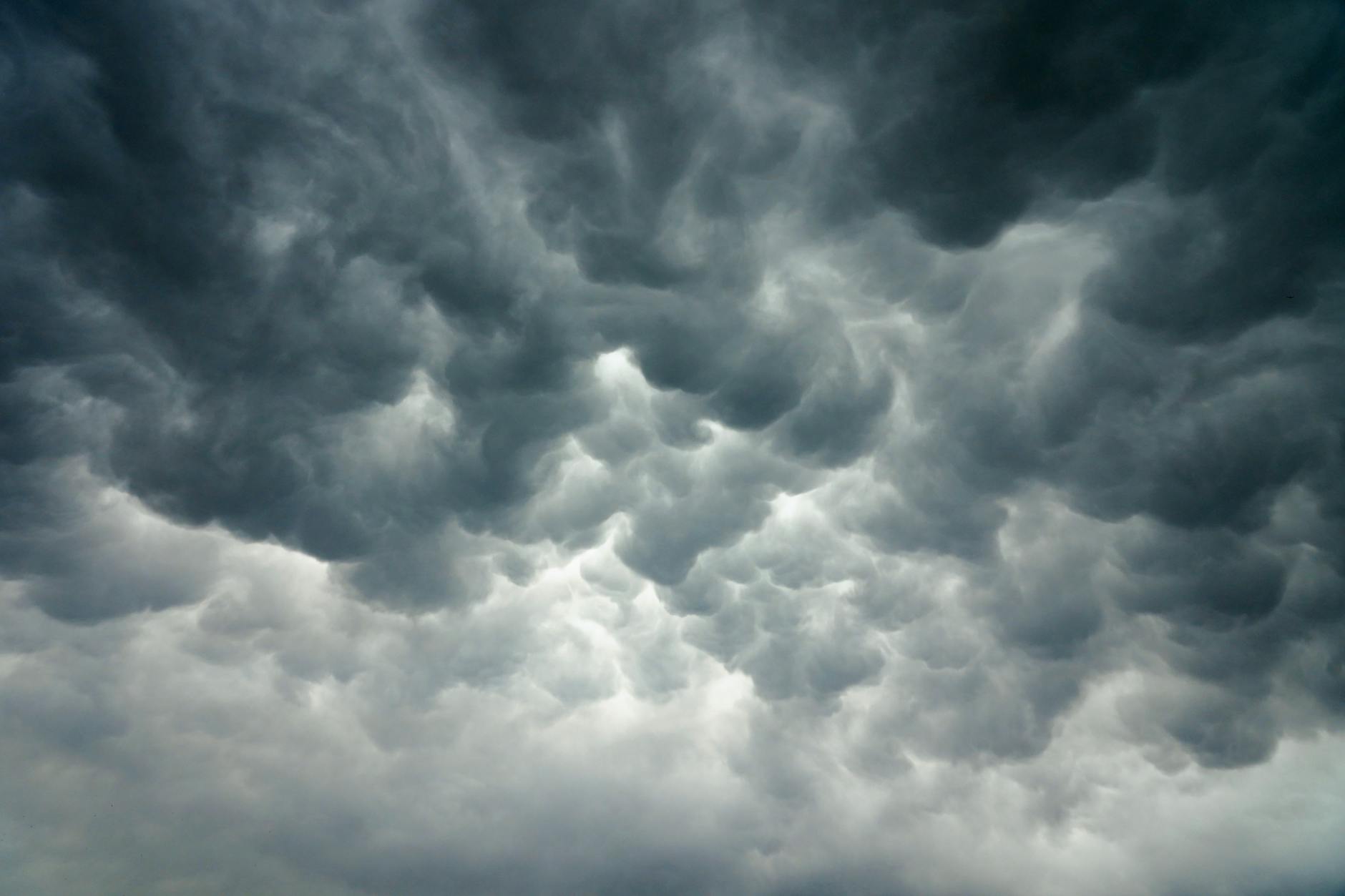 Dark storm clouds gathering over urban landscape