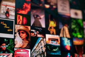 A creative desk workspace with overlapping magazine cutouts and mood board elements representing collage culture