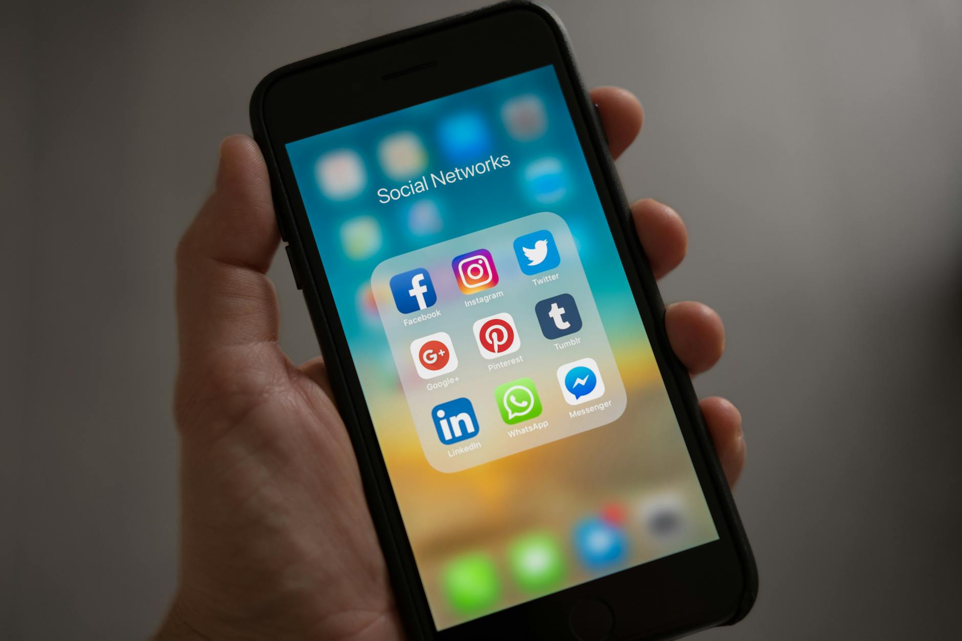 Person scrolling through social media notifications on a smartphone