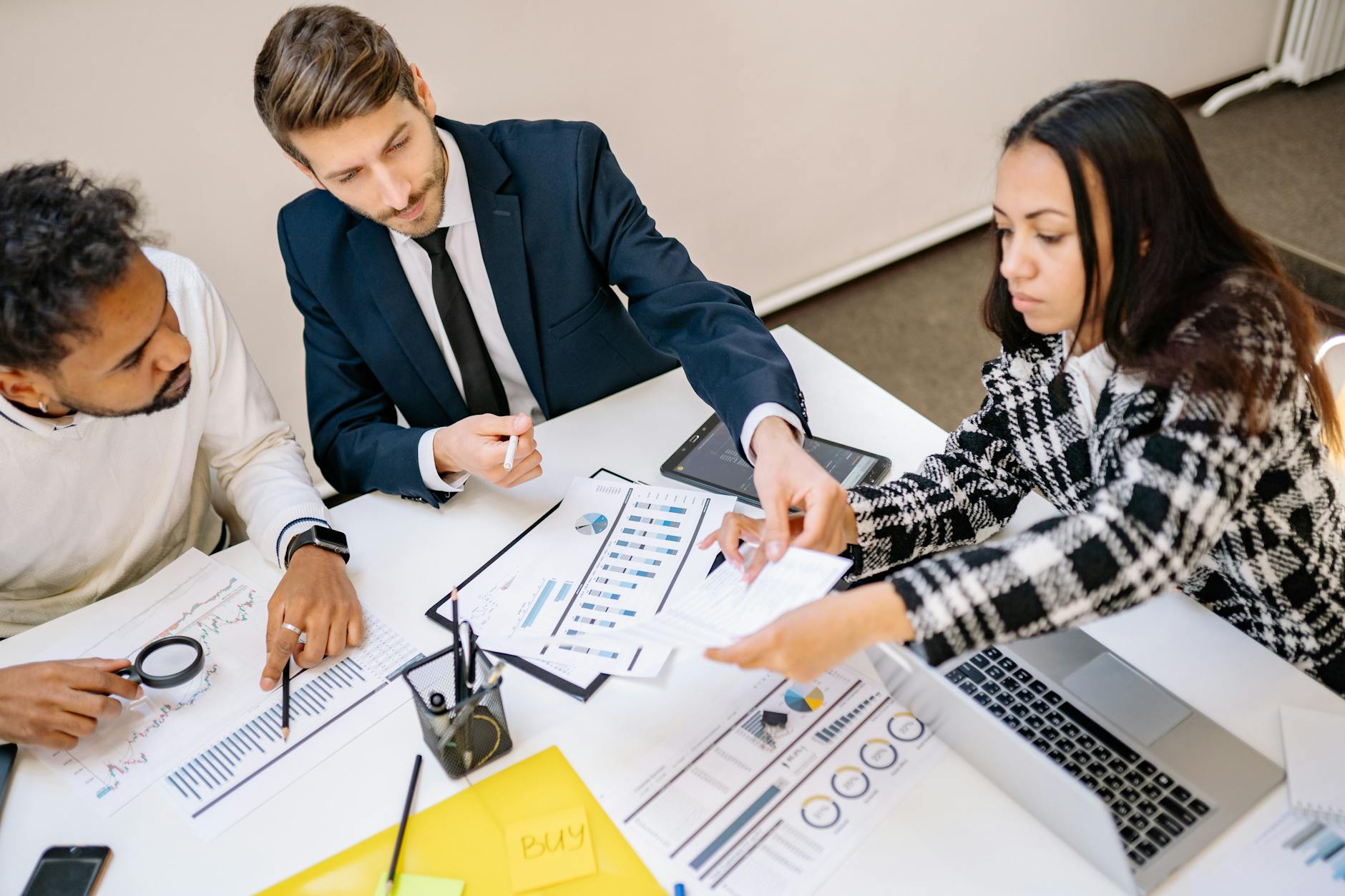 Business professionals reviewing content performance data together in a meeting room