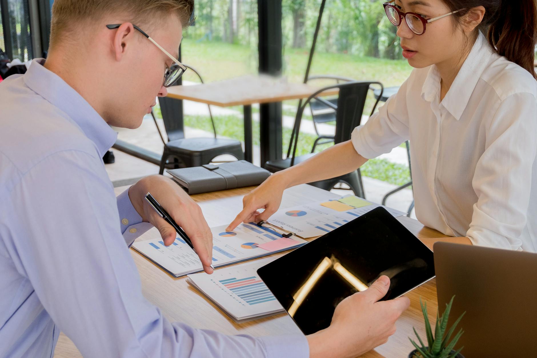 B2B marketing team discussing content strategy around a conference table