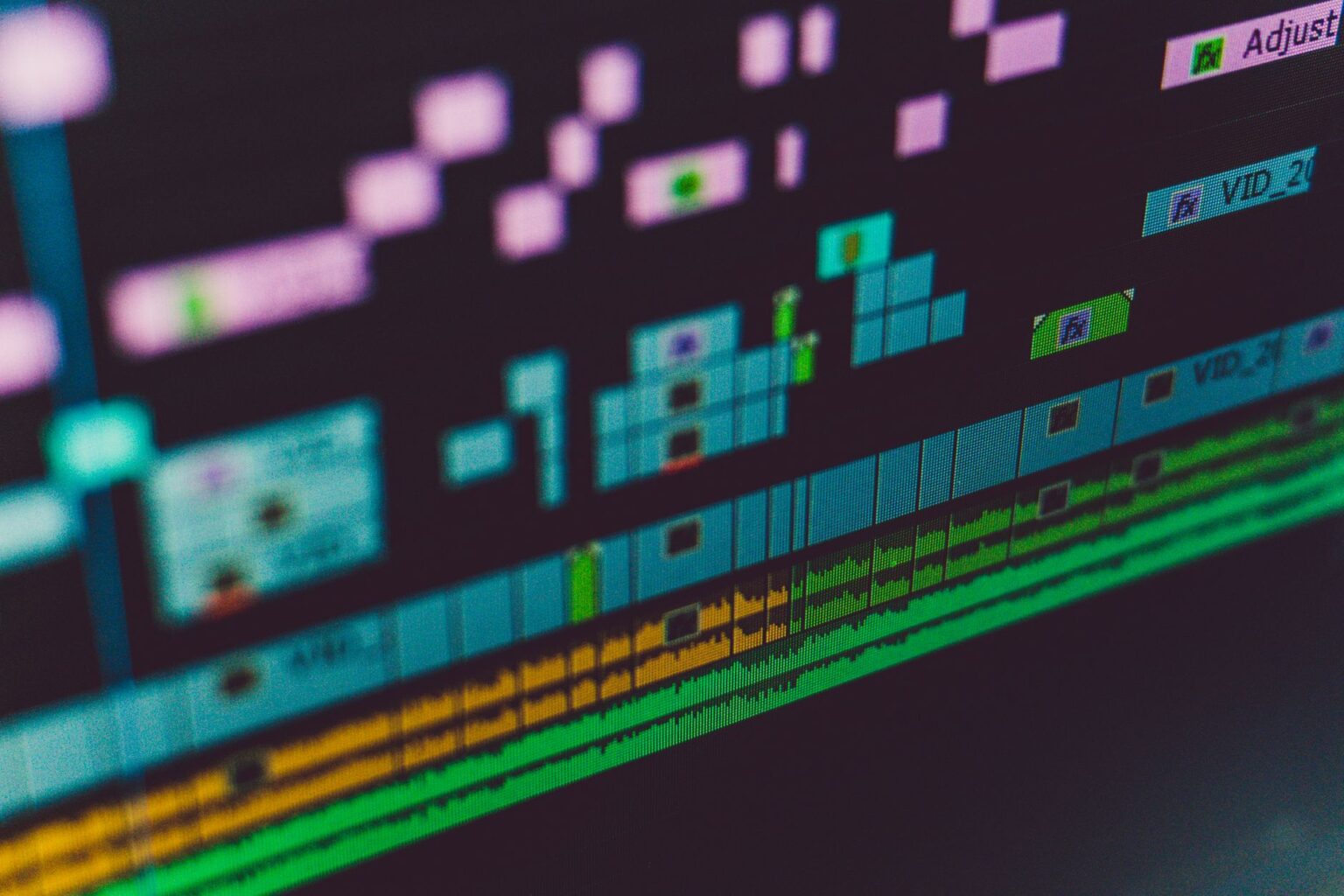 A content creator editing a video timeline on a computer screen