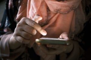 Person scrolling through short video content on a smartphone