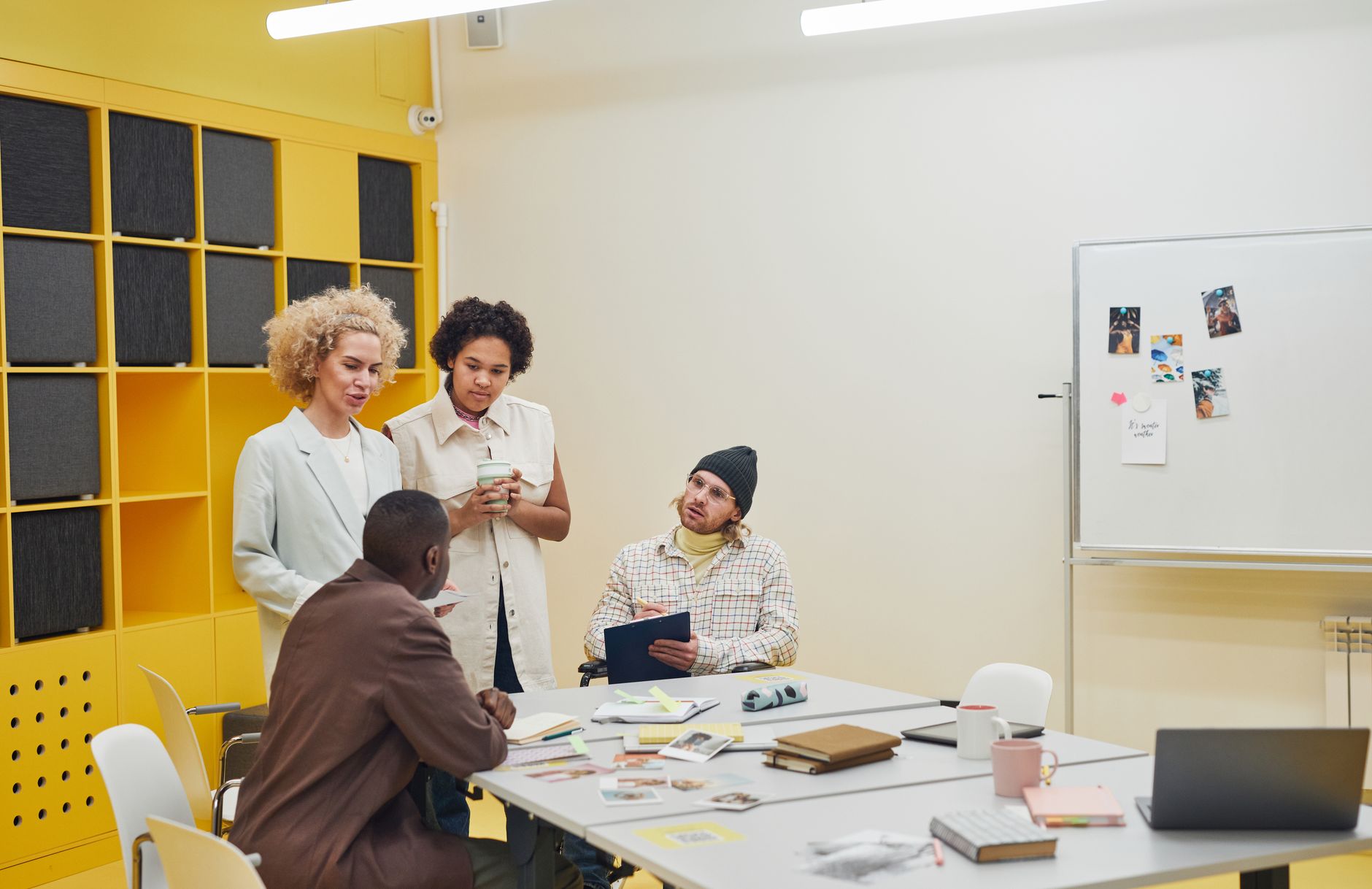 A small team reviewing content strategy documents in a modern office setting