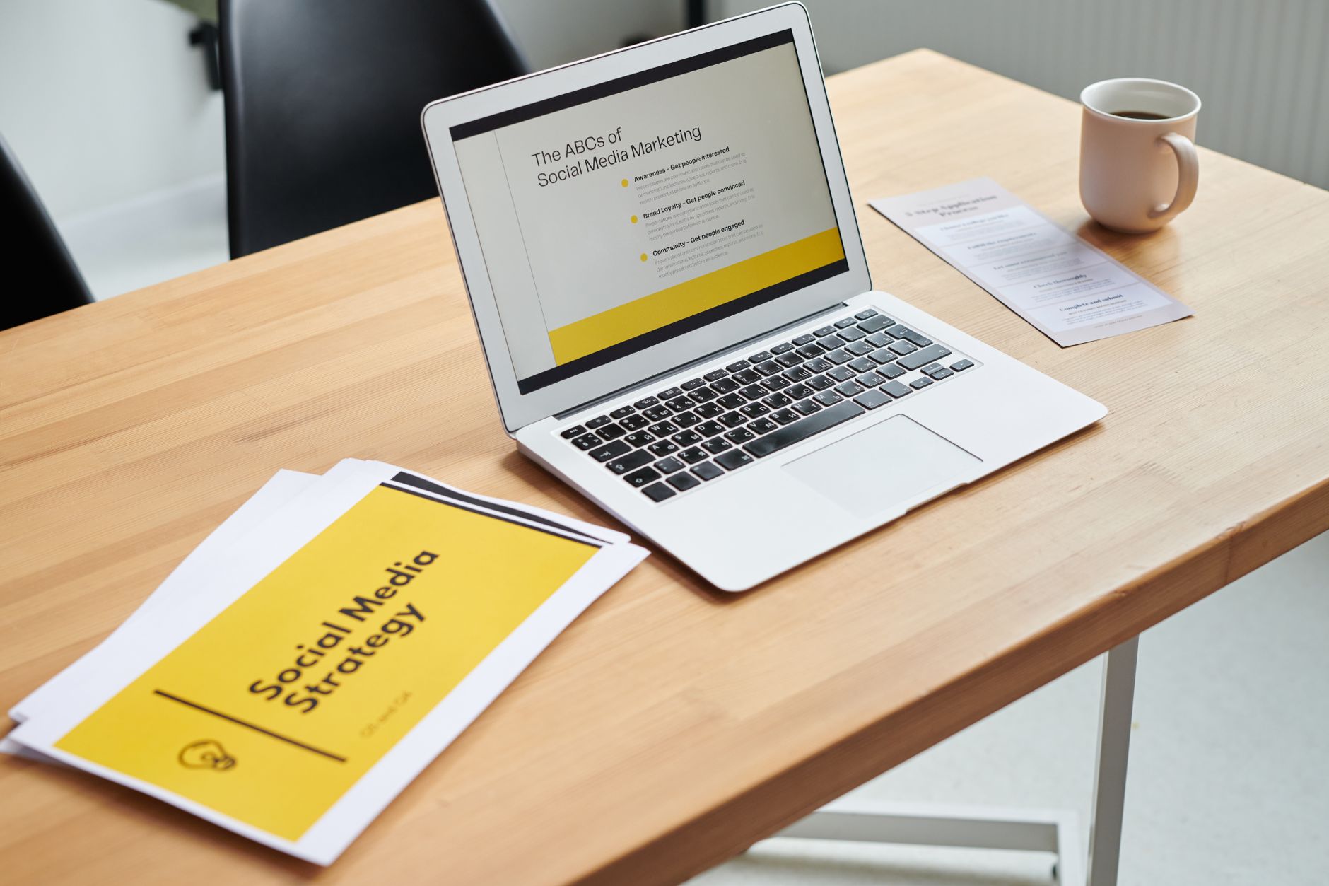 Marketing professional reviewing content strategy on computer at desk