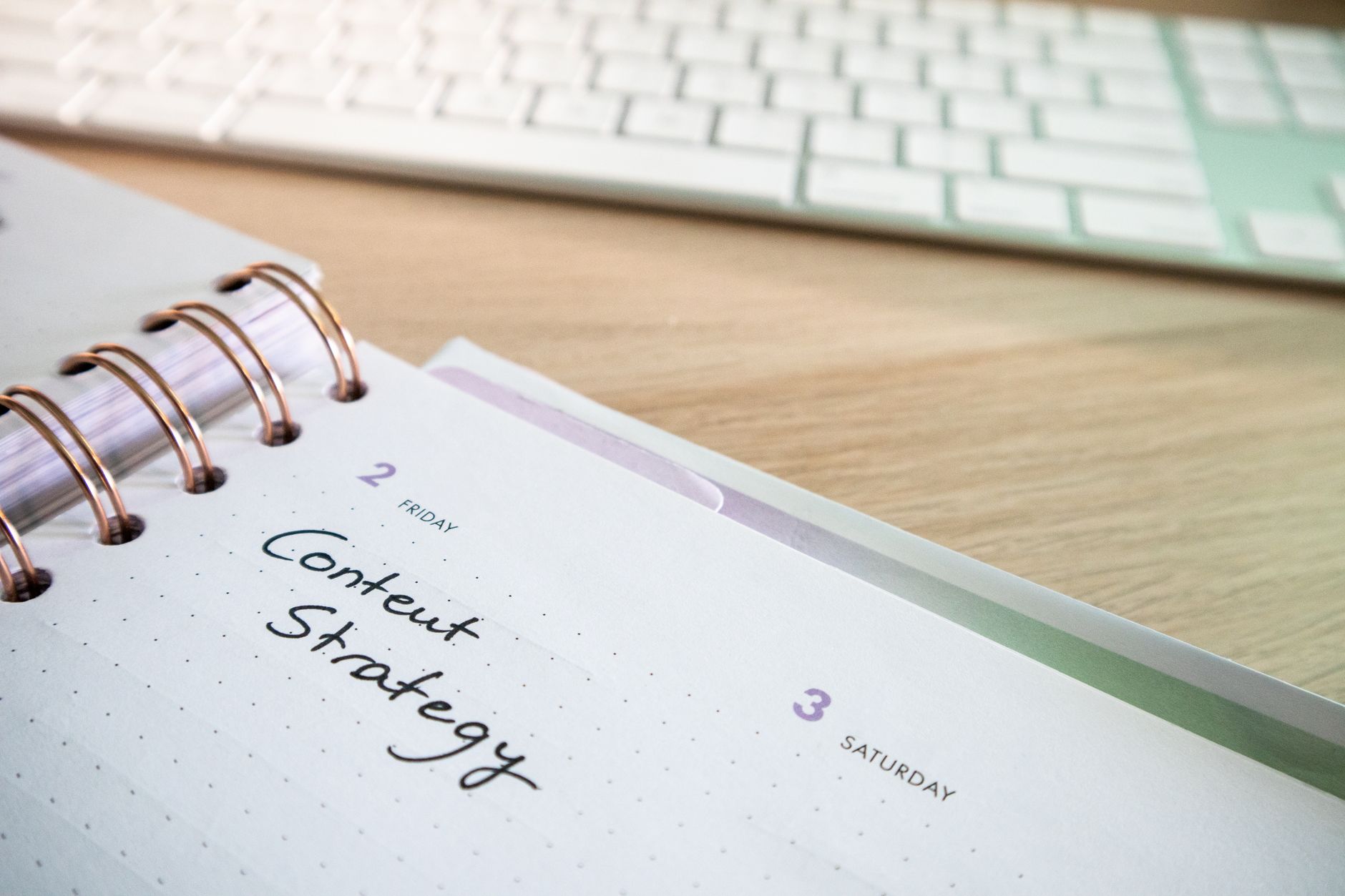 Social media content calendar open on a computer screen at a desk