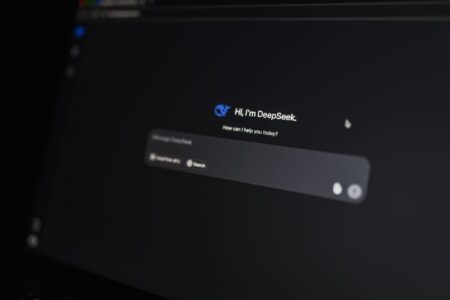 A person using an AI-powered search interface on a laptop screen