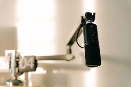 Close-up of a podcast microphone in a recording studio setup
