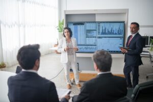 A presentation displayed on a screen in a modern office environment