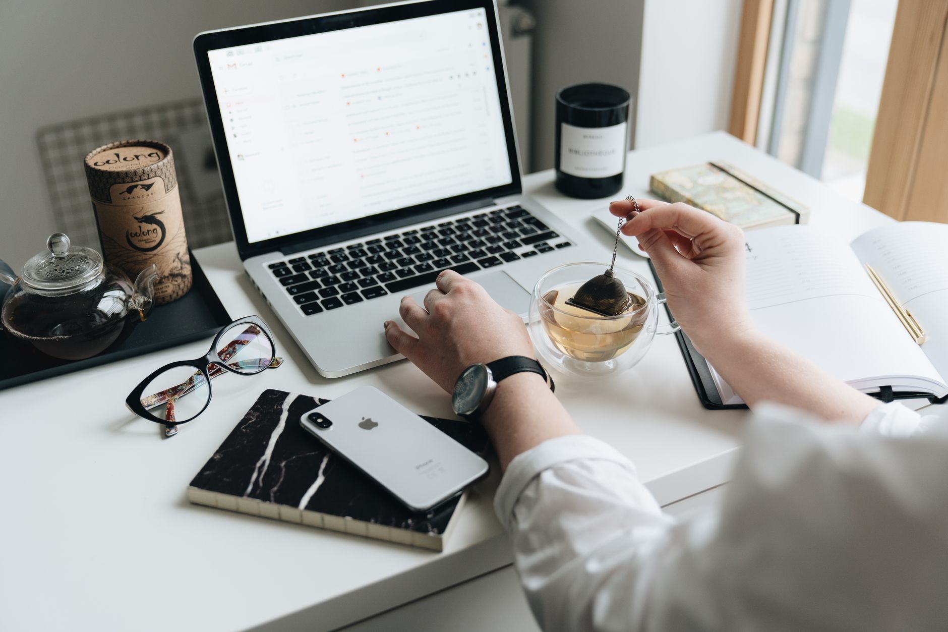 A writer working on a newsletter at a clean desk workspace