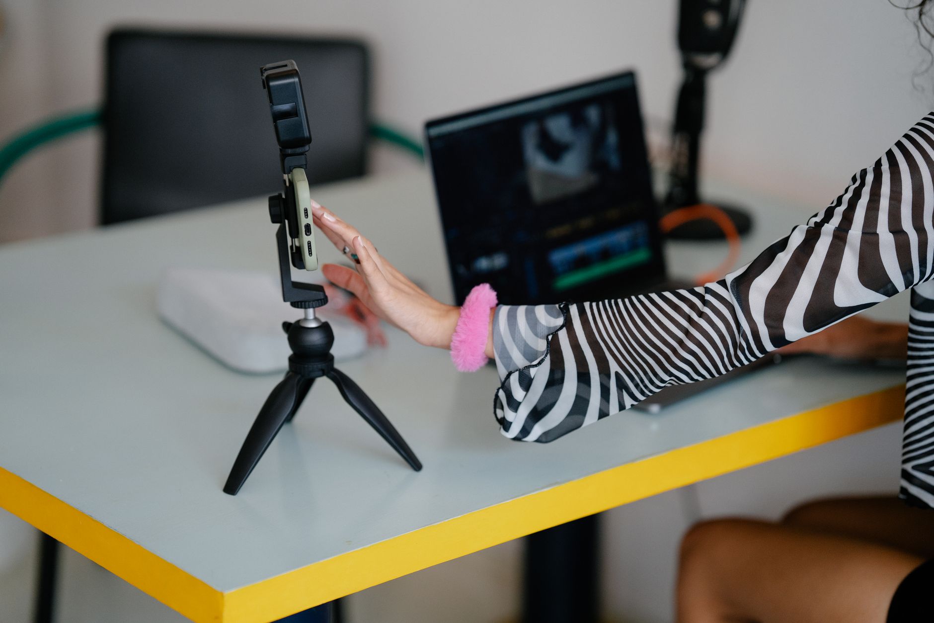 Content creator working at a desk with digital tools on screen