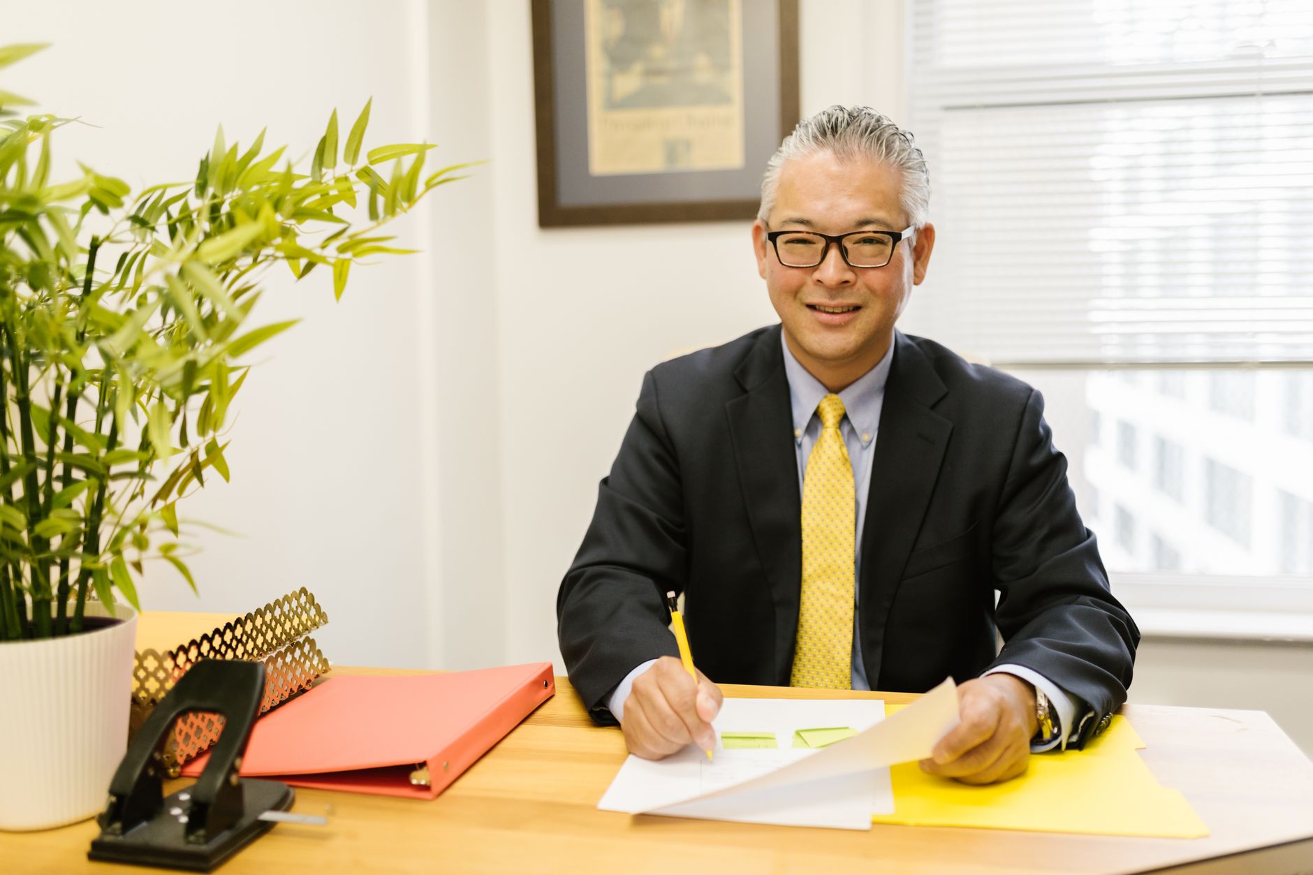 Corporate executive at a desk representing personal brand content creation