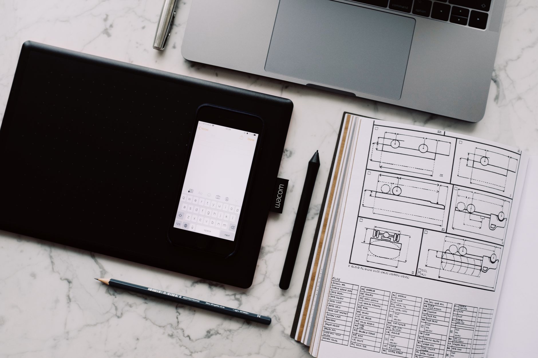 Digital marketing workspace with multiple tools and screens open for content production