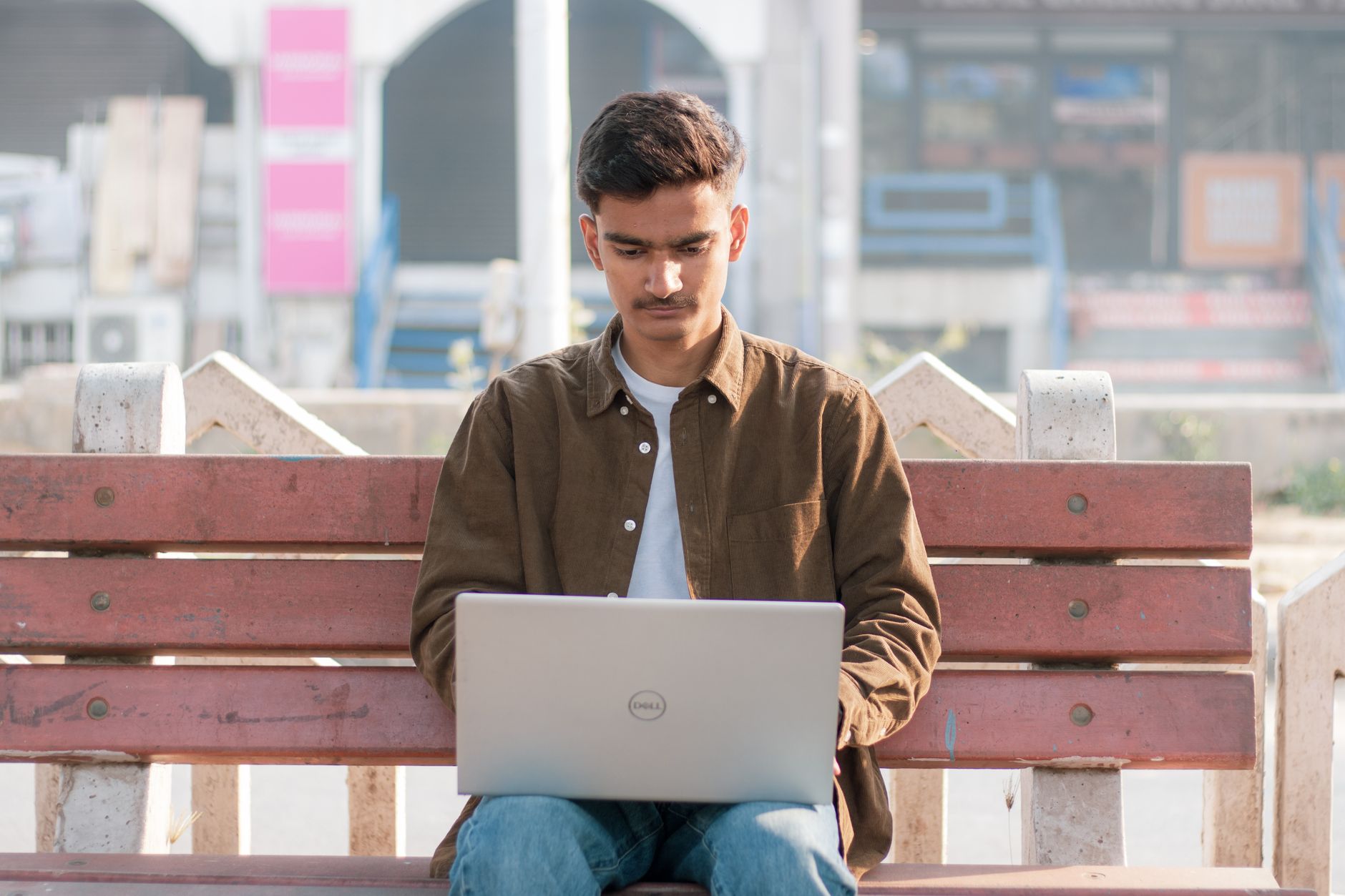 Solo creator working on laptop managing content and automation tools from a single platform