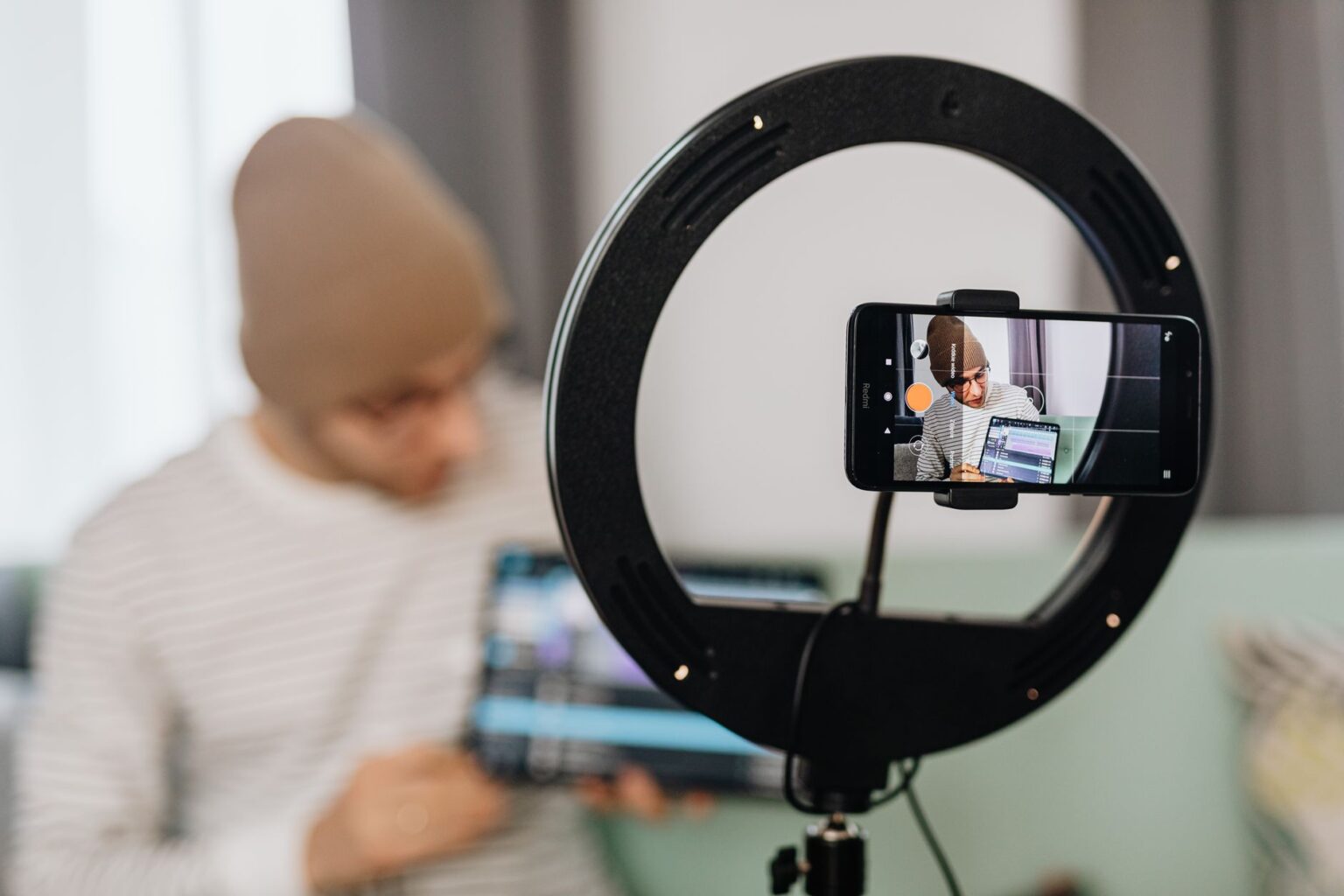 CapCut’s Auto-Captions Are Quietly Replacing Rev for Short-Form Video Person editing a short-form video on a smartphone with caption tools visible on screen