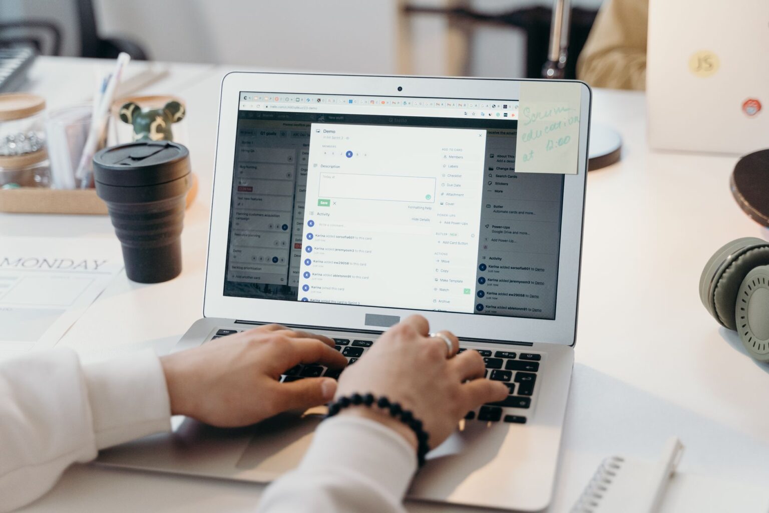 Beehiiv’s Recommendation Network Is Quietly Replacing SparkLoop for Newsletter Growth A person reading newsletter emails on a laptop at a desk, representing newsletter growth strategy
