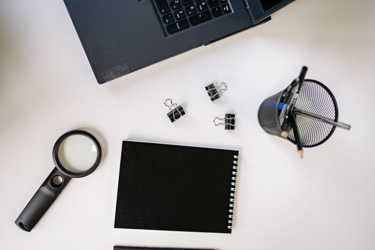 Perplexity’s Pages Feature Is Quietly Replacing Notion AI for Research A clean desk workspace with a laptop open to a research document