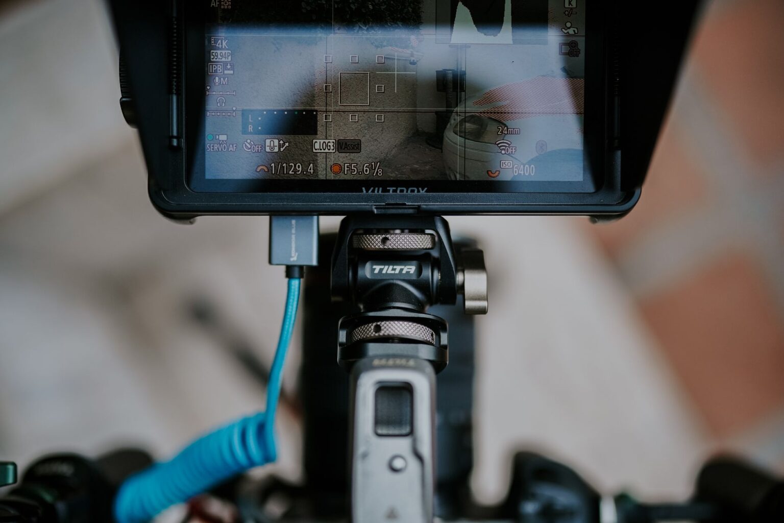 Descript’s Teleprompter Mode Is Quietly Replacing Speeko for Video Creators A video creator recording content at a desk with a camera and monitor setup