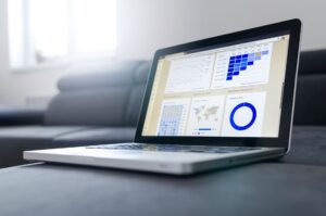 A creator reviewing link analytics on a laptop dashboard