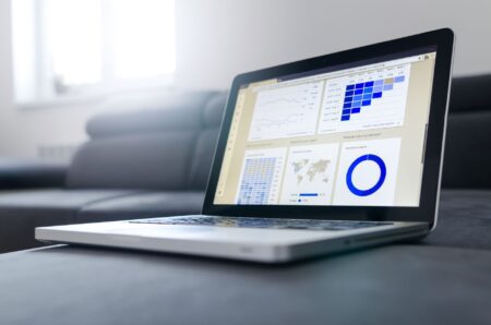 A creator reviewing link analytics on a laptop dashboard