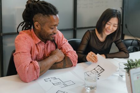 Social media team collaborating on content strategy at a shared desk