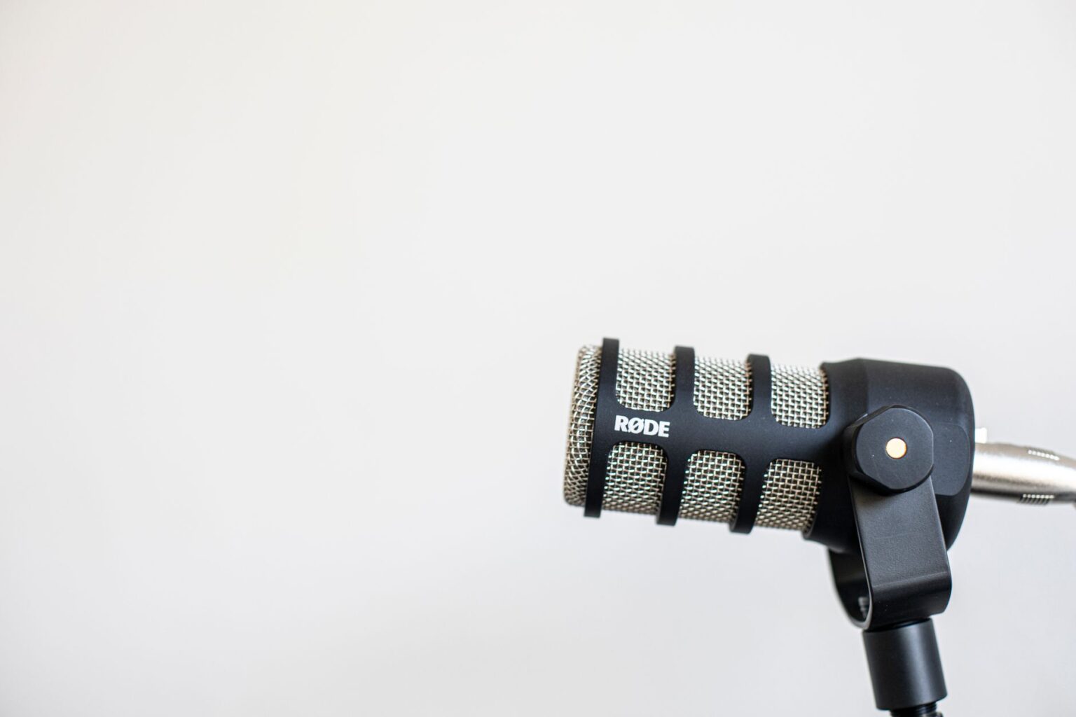 Close-up of a condenser microphone in a home recording setup